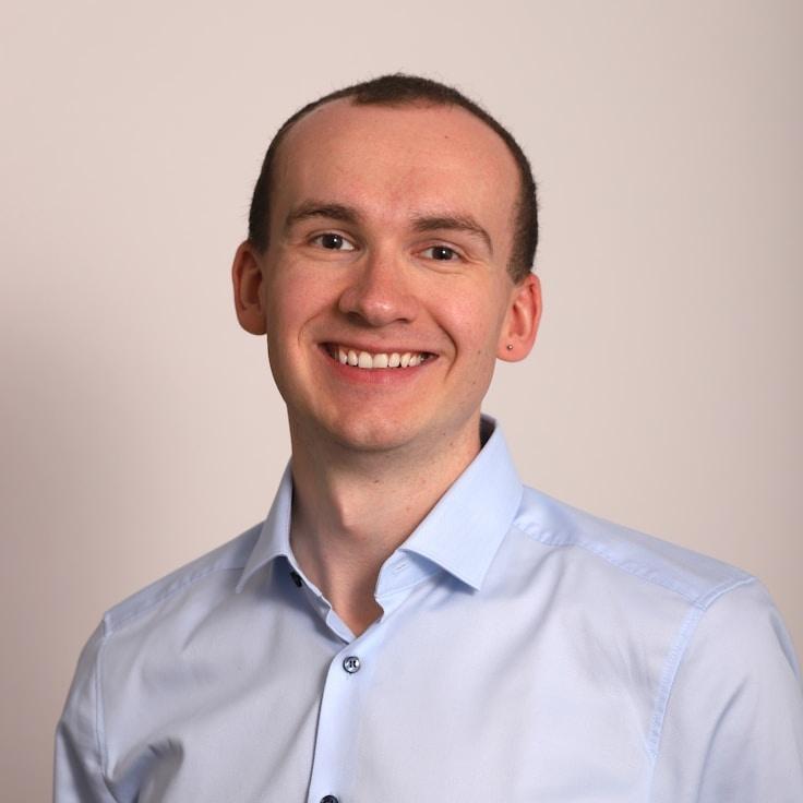 Kaveri Mehta, Lead Design Curator at PeaceFulValleyCollective, reviewing corporate floral arrangements